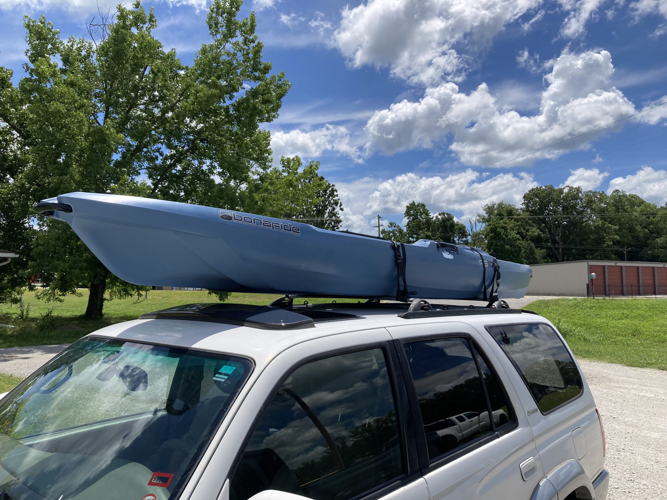 Bonafide RS117 strapped to the roof rack, ready for a day on the water